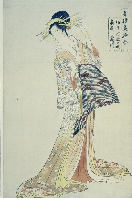 Colour woodblock print, part of triptych. Courtesan Takikawa of Ogiya making final adjustment to hairpin, ready for New Year customers. Inscribed