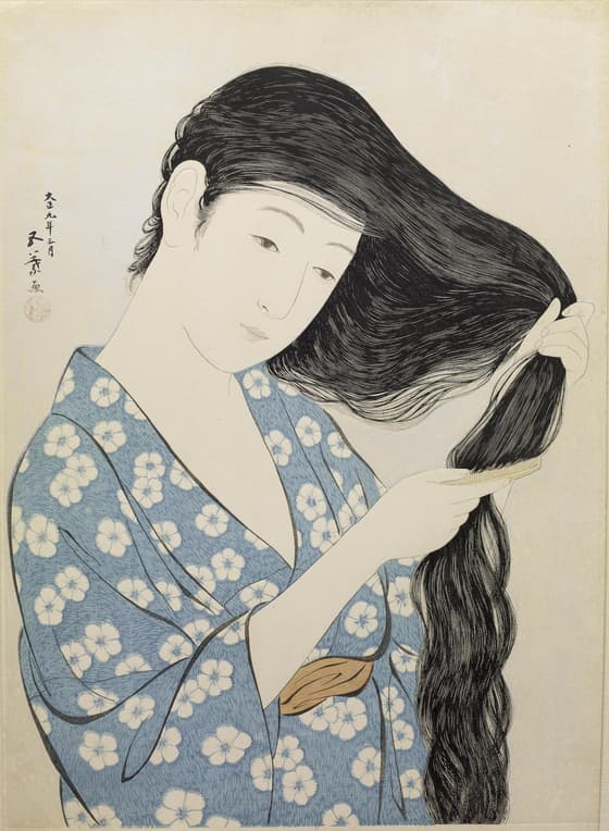 髪梳ける女